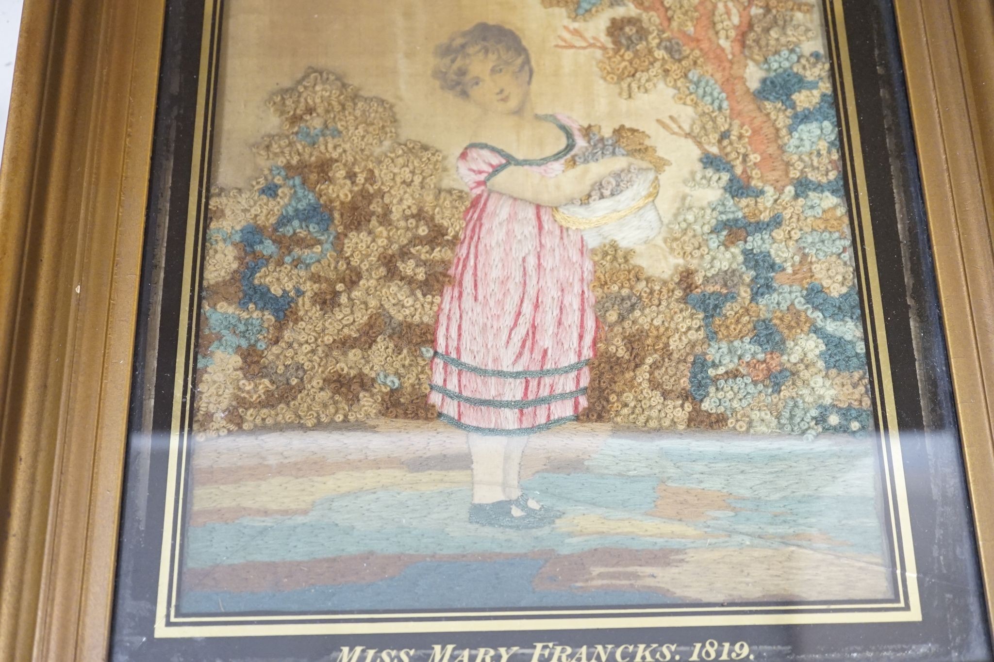 A Regency woolwork picture, entitled Mother’s Joy, named Miss Mary Francks and dated 1819, 30 x 22cm